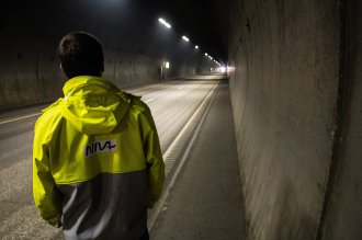 Researcher looking down tunnel